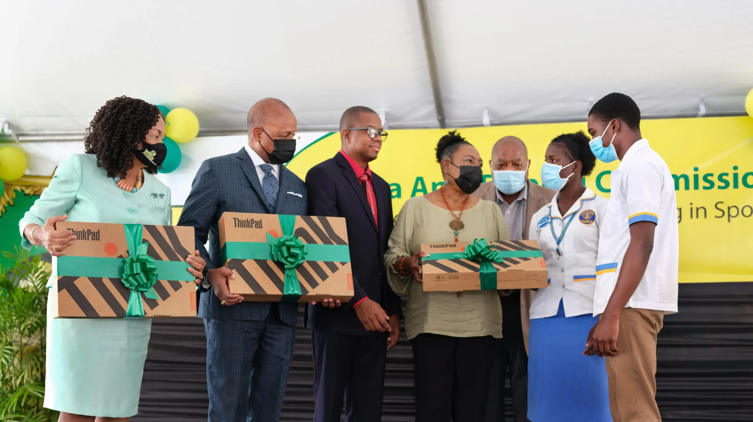 Minister Grange, Alexander Williams Issues Laptops to Guys Hill High School
